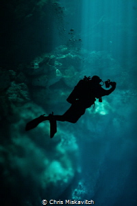 Light in front of this diver as he comes out of the shado... by Chris Miskavitch 